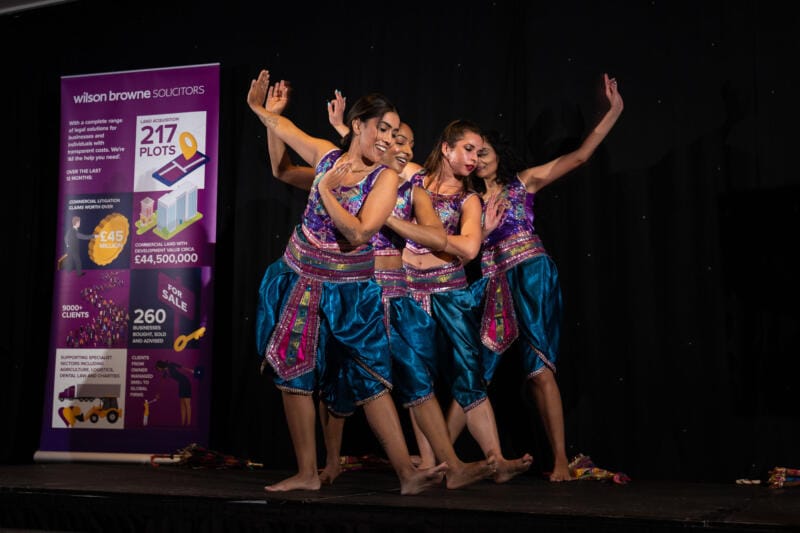 A group of ladies doing a dance